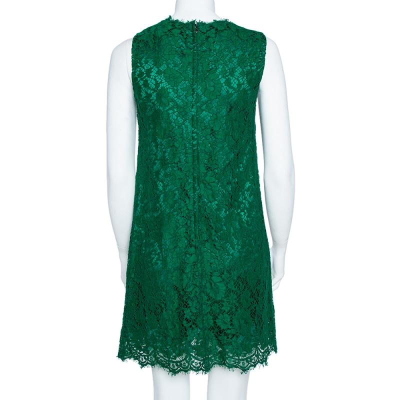 Effortless and elegant, this ensemble by Dolce & Gabbana is stunning. Perfect for an evening out, this shift dress has been crafted from intricate green lace lending a delicate touch to the green-hued exterior. The sleeveless dress has a round neck