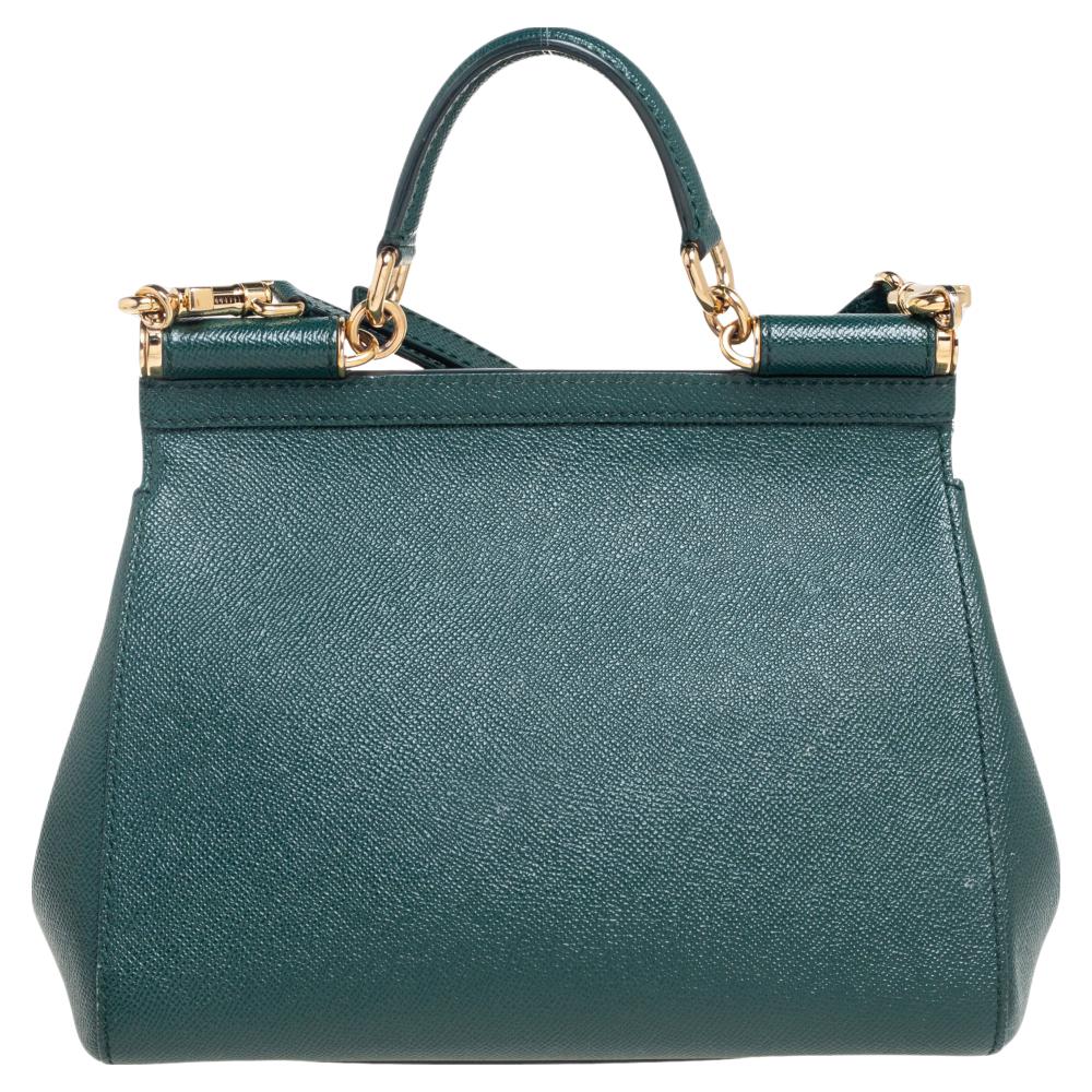 This gorgeous green Miss Sicily satchel from Dolce & Gabbana is a handbag coveted by women around the world. It has a well-structured design, a flap that opens to a compartment with a fabric lining, and enough space to fit your essentials. The bag