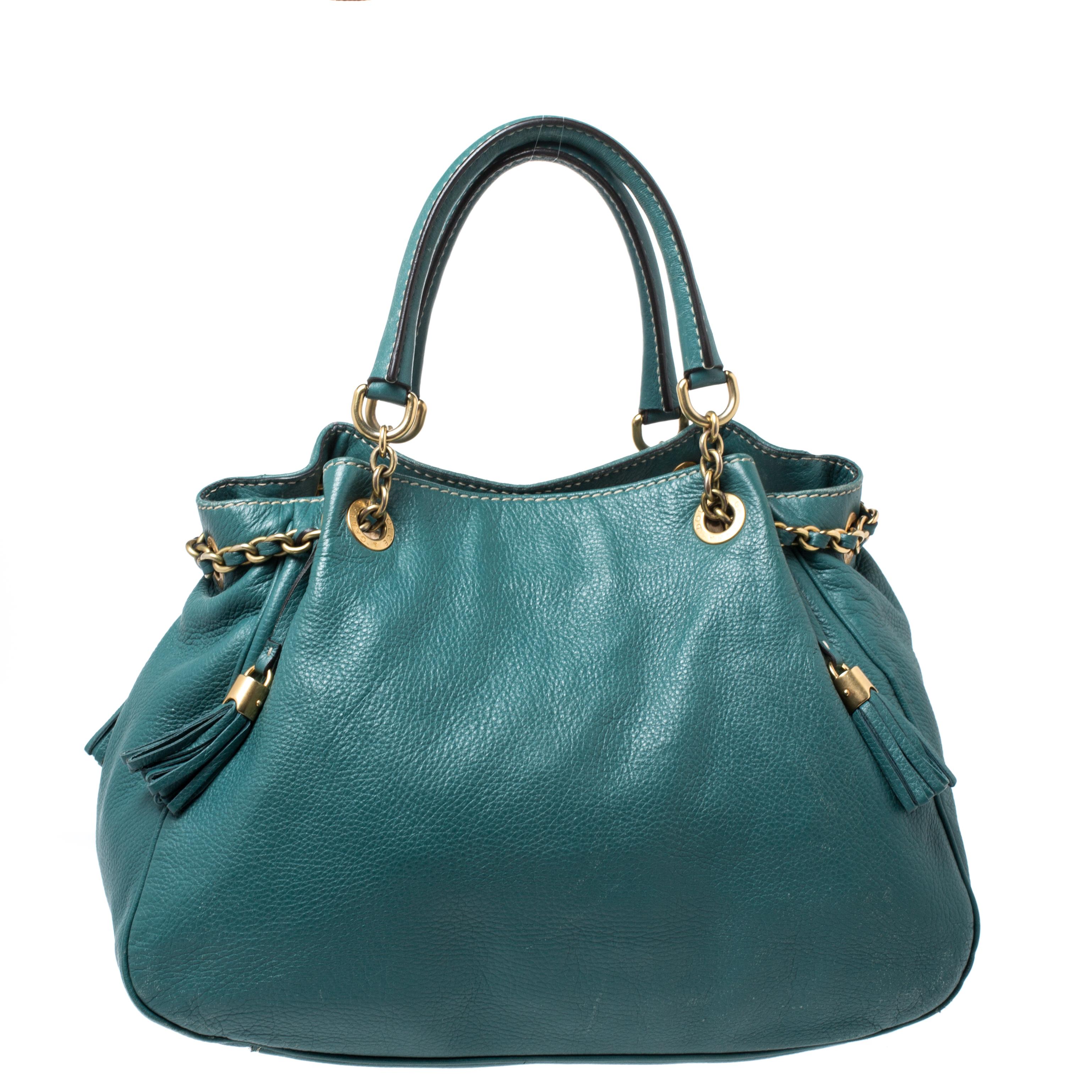 This stunning masterpiece is a must-have. Dolce & Gabbana delivers a chic style with this Miss Charlotte satchel Crafted in Italy, it is made of quality leather and comes in a lovely shade of green. It is styled with dual handles embellished with