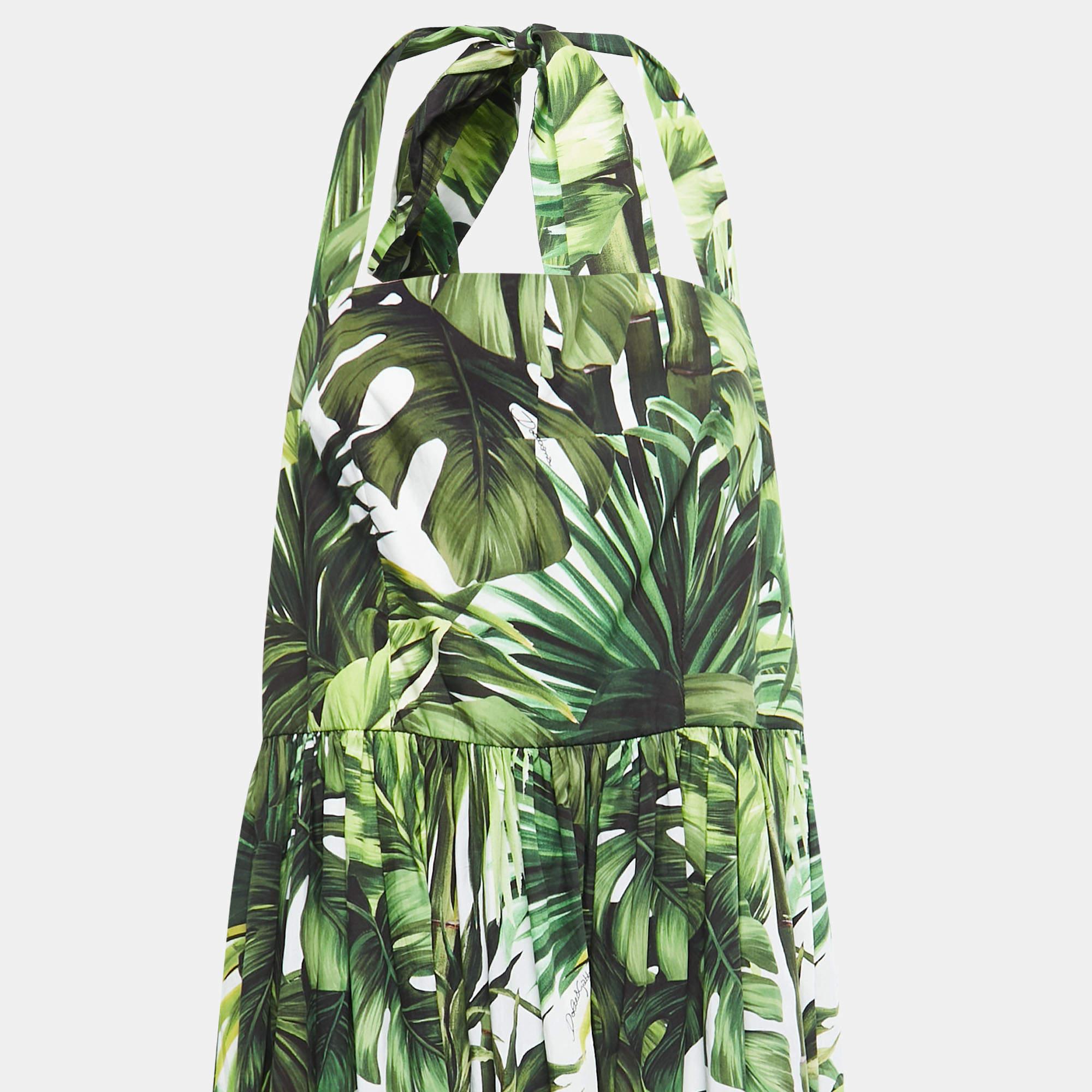 It's vibrant, joyful, and comfortable! This Dolce & Gabbana cotton dress has a simple silhouette alight with palm leaf prints. The halter neck tie adds to the appeal.

Includes: Brand Tag