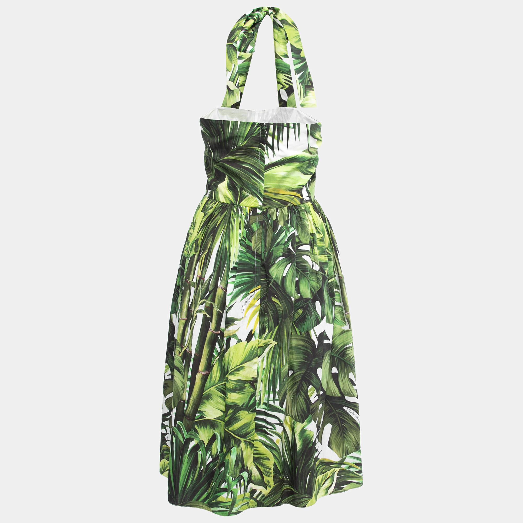 The Dolce & Gabbana dress is a perfect choice for summer with its vibrant and blooming floral print. The dress features a flattering silhouette, lightweight fabric, and a playful design that exudes feminine charm. Embrace the season's joy and