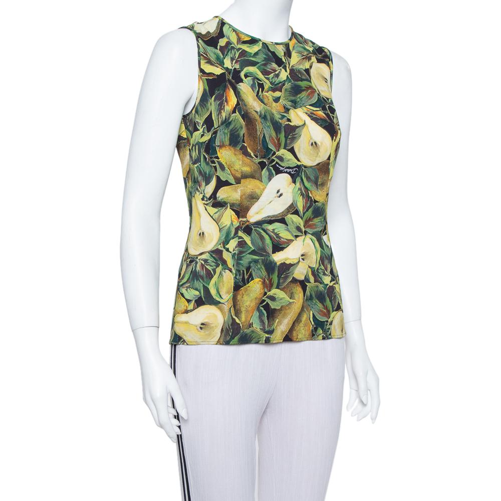 Possessing a legacy of romantic inspiration and styles, Dolce & Gabbana presents us with this green-hued sleeveless top, featuring a fitted silhouette, a round neck, a subtle back zip fastening, and an original pear print all over. Wear it with a