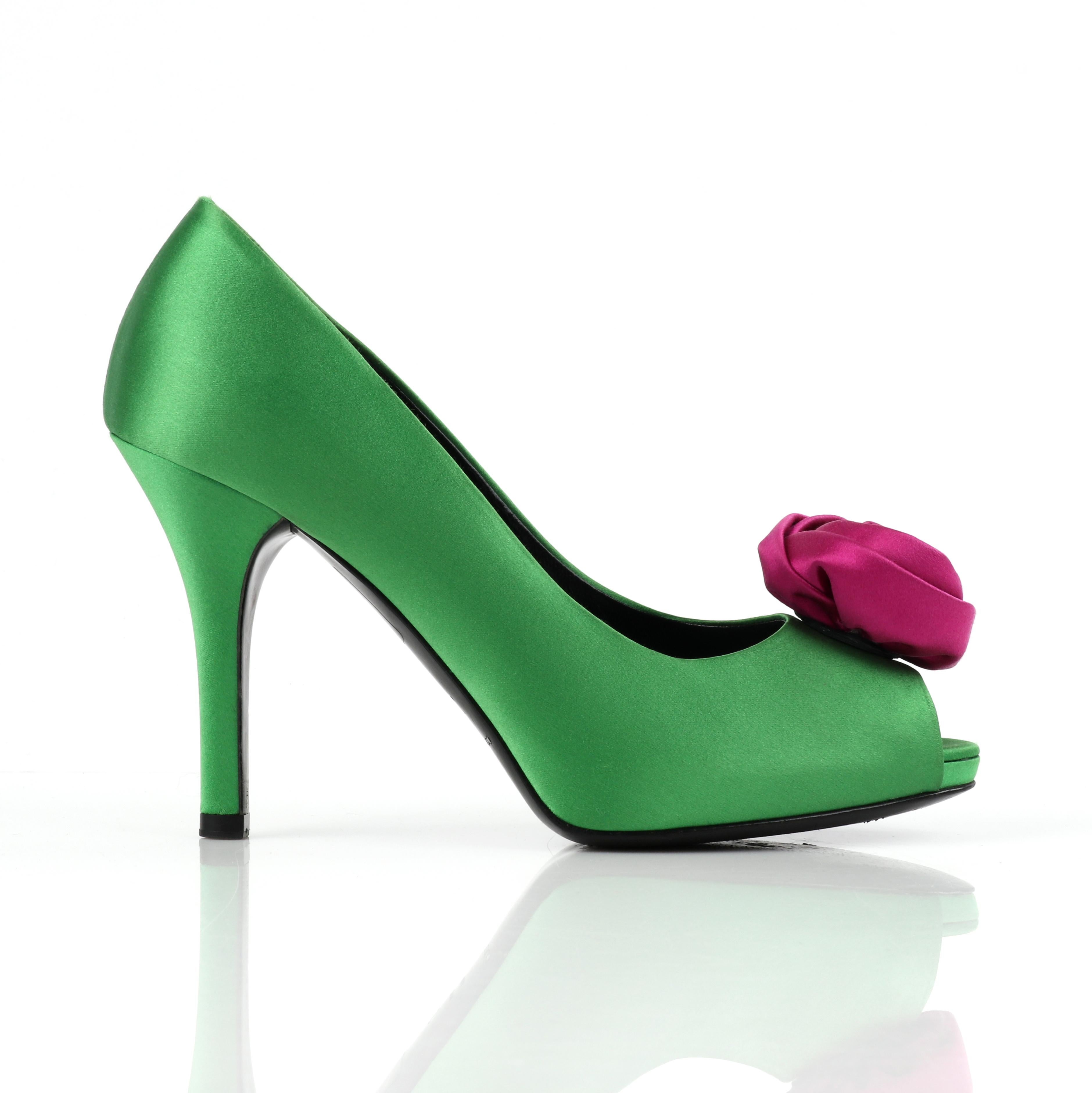 DOLCE & GABBANA Green Pink Satin Rosette Flower Peep Toe Platform Pumps
  
Brand / Manufacturer: Dolce & Gabbana
Designer: Dominico Dolce & Stefan Gabbana
Style: Pump / heels
Marked Size: 37
Color(s): Apple green, magenta pink (exterior); black