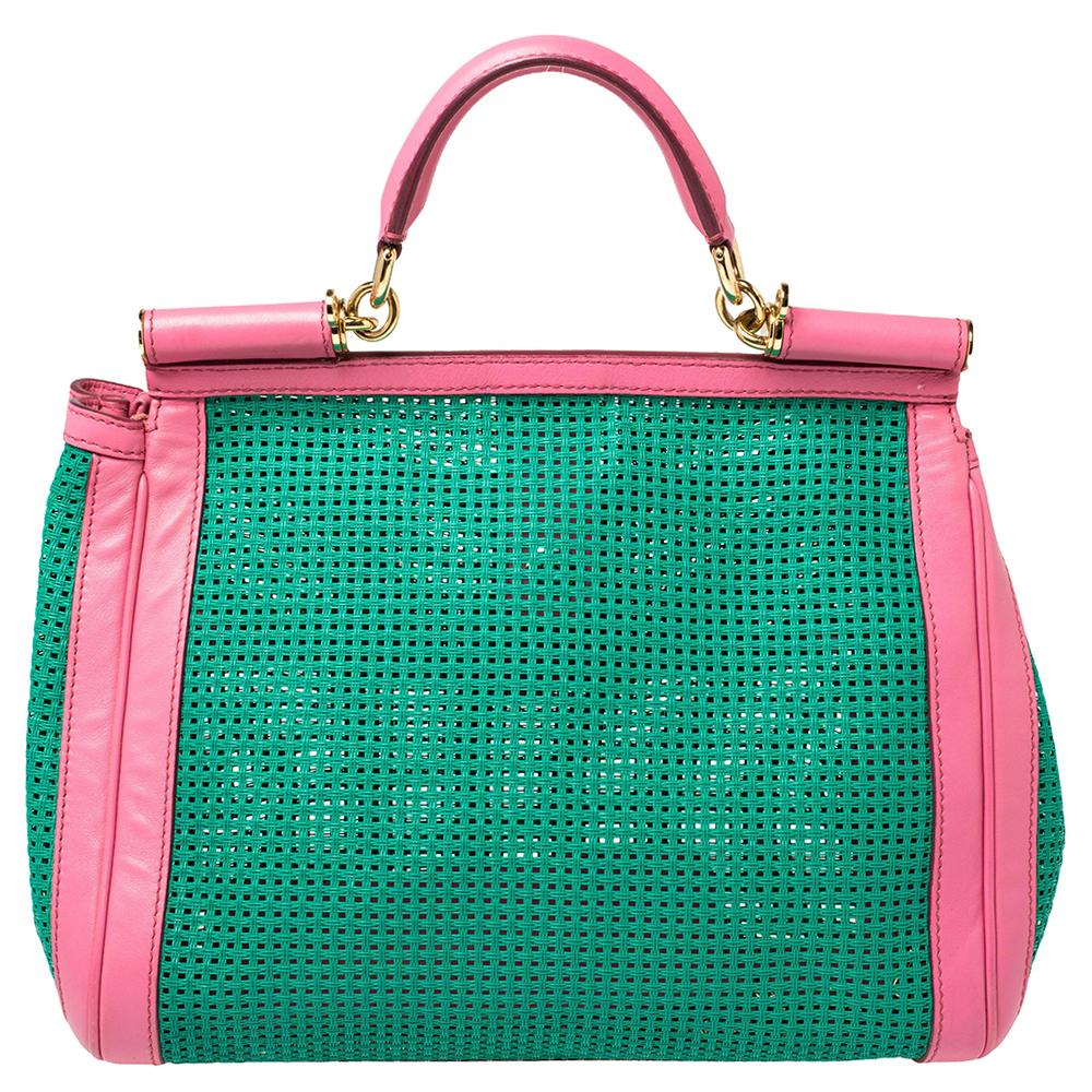 This gorgeous green Miss Sicily from Dolce & Gabbana is a handbag coveted by women around the world. It has a lovely design, contrasting pink trims, and a flap that opens to a compartment with enough space to fit your essentials. The bag comes made