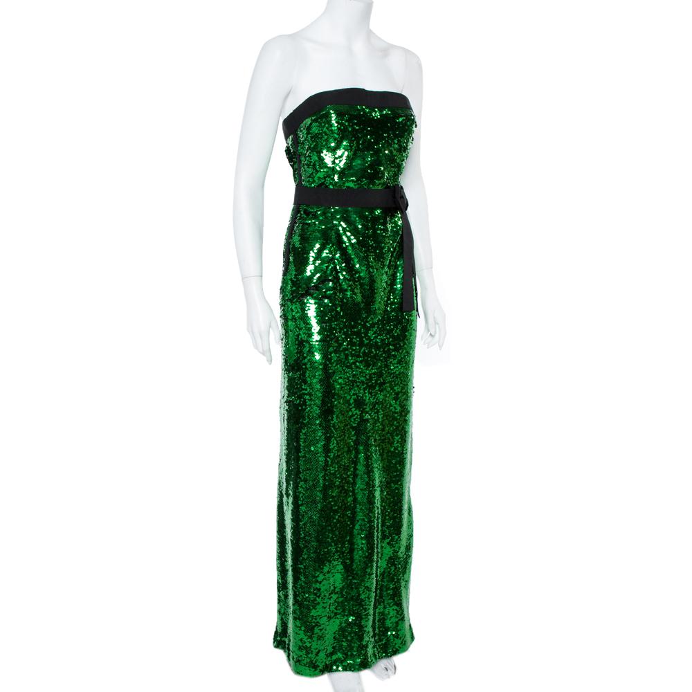 This gorgeous maxi number from Dolce & Gabbana will make sure you make a glamorous style statement! The green strapless creation features a flattering silhouette and has been embellished with sequins all over. It flaunts a bow detailed belt on the