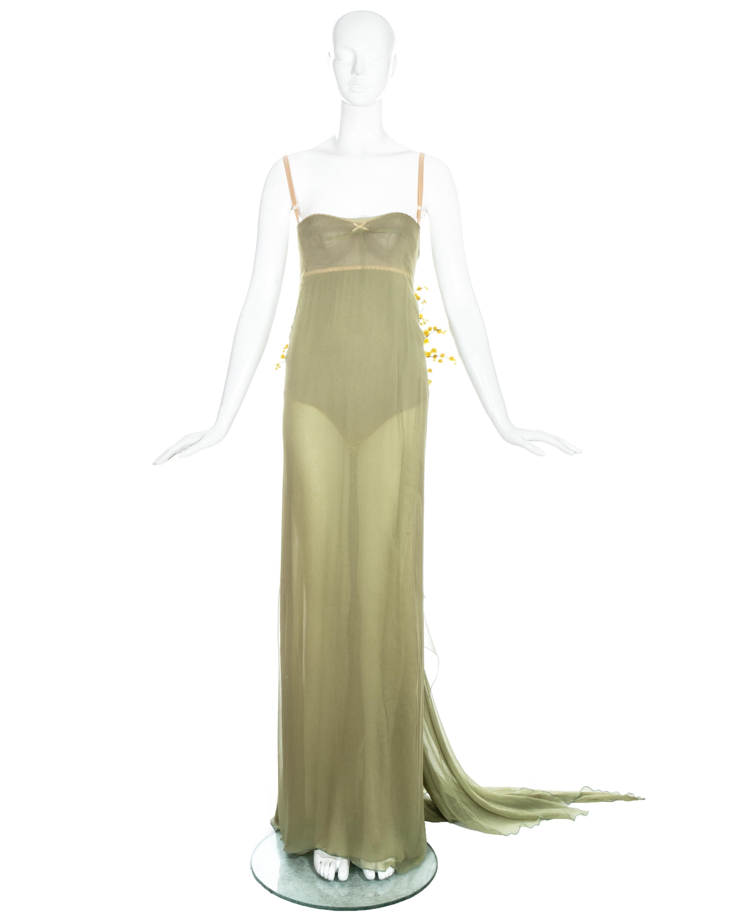Dolce & Gabbana pistachio green silk chiffon evening dress with trained hem, built-in corseted nude bodysuit and a floral bouquet appliquéd at the rear. 

Spring-Summer 1999