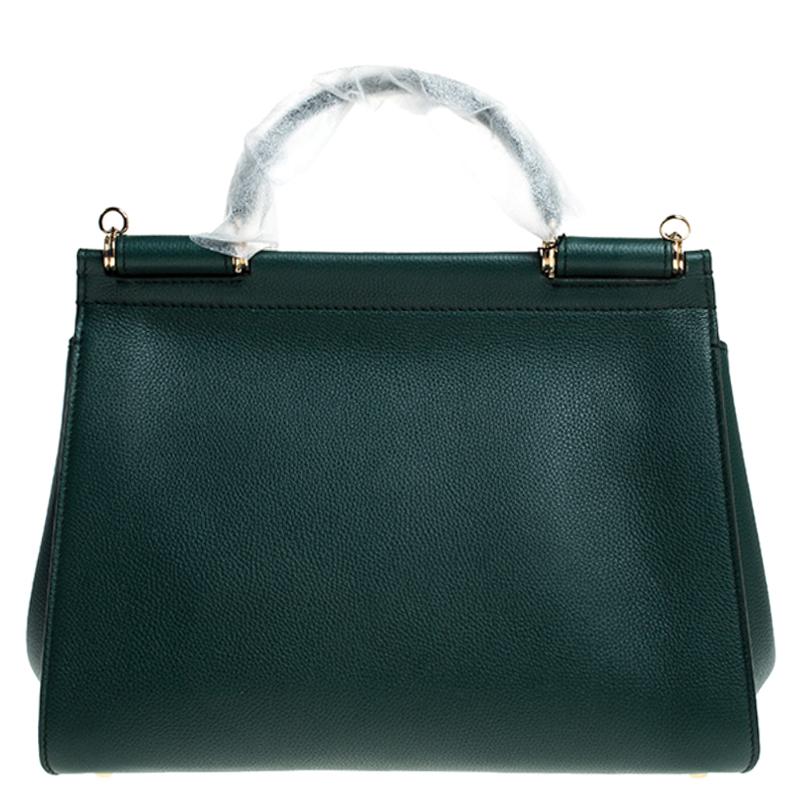 This gorgeous green Miss Sicily satchel from Dolce & Gabbana is a handbag coveted by women around the world. It has a well-structured design and a flap that opens to a compartment with fabric lining and enough space to fit your essentials. The bag