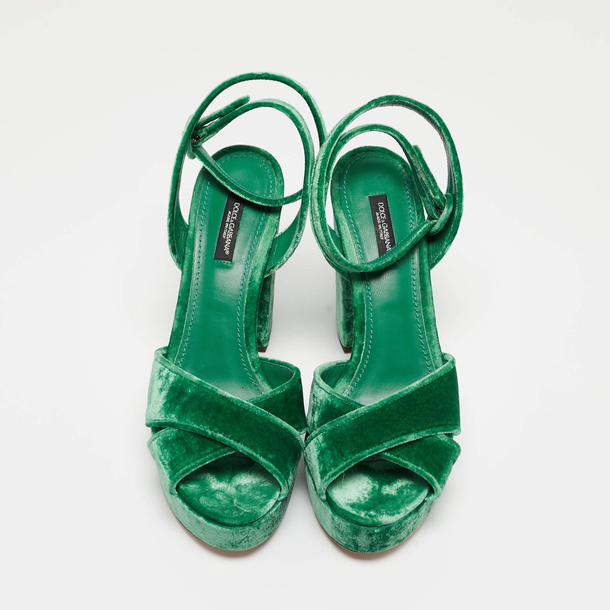 Make a statement with these Dolce & Gabbana green sandals for women. Impeccably crafted, these chic heels offer both fashion and comfort, elevating your look with each graceful step.

Includes: Original Dustbag, Original Box


