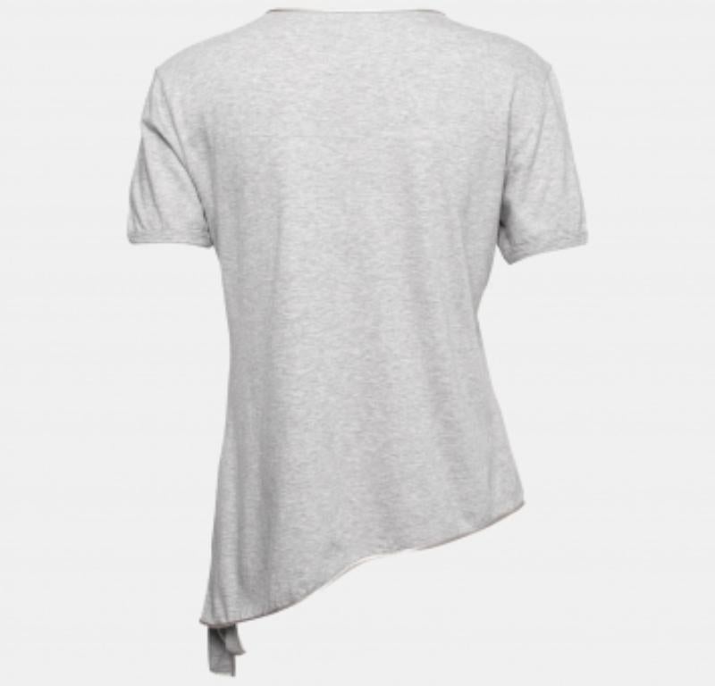 Pour votre prochaine sortie décontractée, portez ce haut Dolce & Gabbana pour une allure chic. Il est créé à partir d'un mélange de tissus de qualité, et son ourlet asymétrique en fait un modèle remarquable. Avec ses manches courtes et son encolure