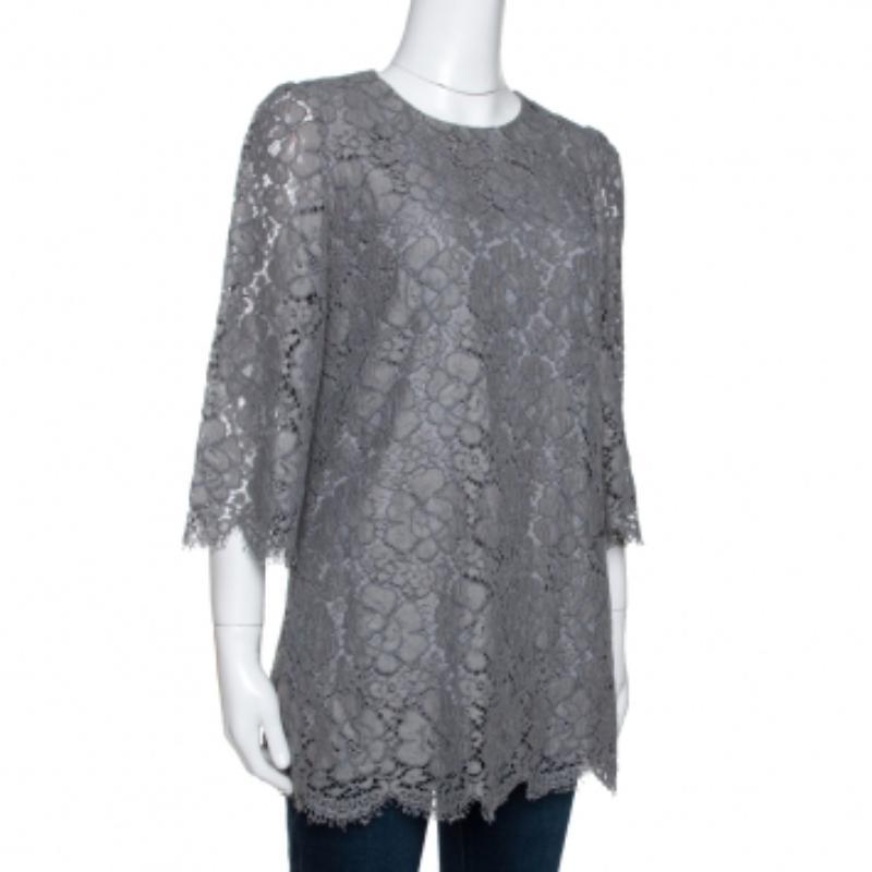 This grey top from Dolce & Gabbana is such a stunner, you'll instantly fall in love with it. The top is made of quality fabrics and features a beautiful floral corded lace overlay. It flaunts a round neckline, three-quarter sleeves and a concealed