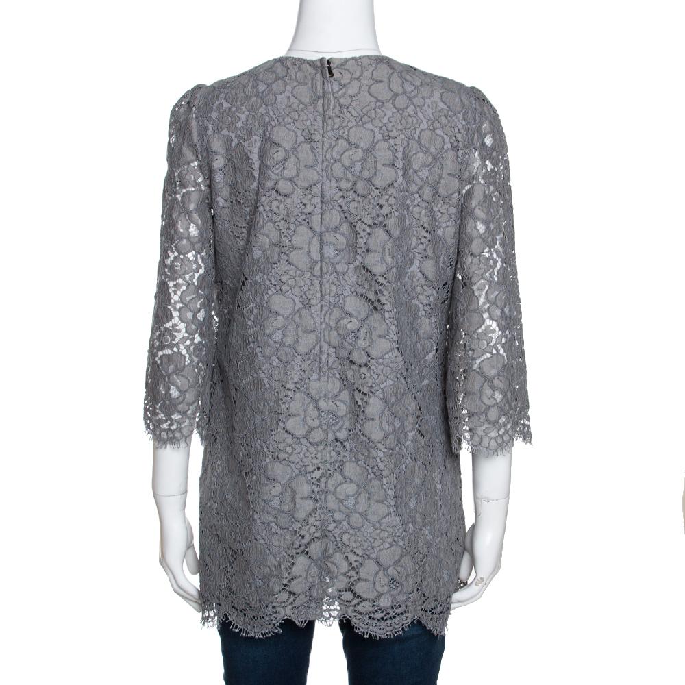 This grey top from Dolce & Gabbana is such a stunner, you'll instantly fall in love with it. The top is made of quality fabrics and features a beautiful floral corded lace overlay. It flaunts a round neckline, three-quarter sleeves and a concealed