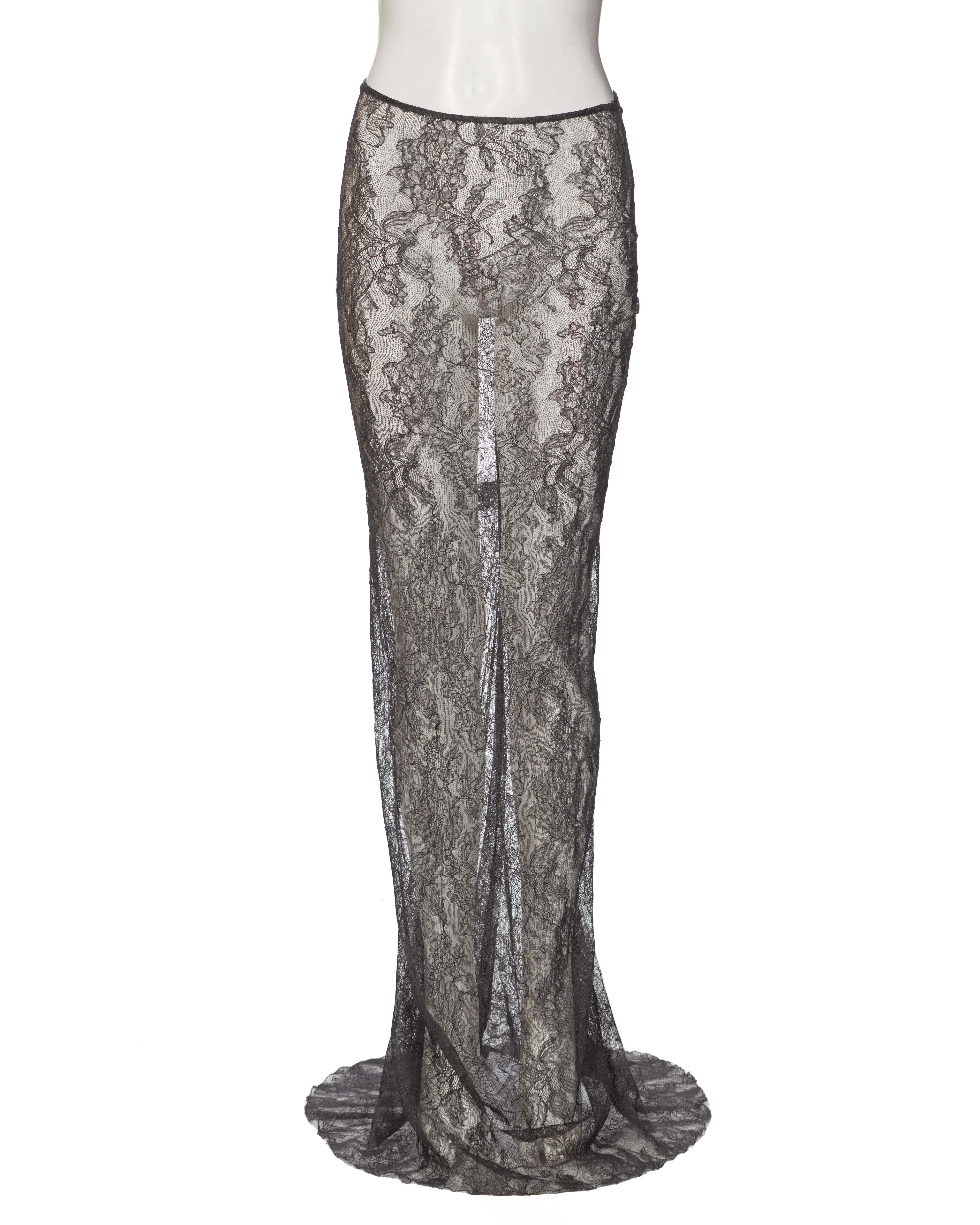 ▪ Archival Dolce & Gabbana Grey Floral Lace Skirt
▪ Spring-Summer 1999
• Floral net lace long skirt with train
• Multiple asymmetric darts along the rear seam
• Concealed zip closure
• Unlined
• Regular fit
• Material: 43% Viscose, 42% Nylon, 15%