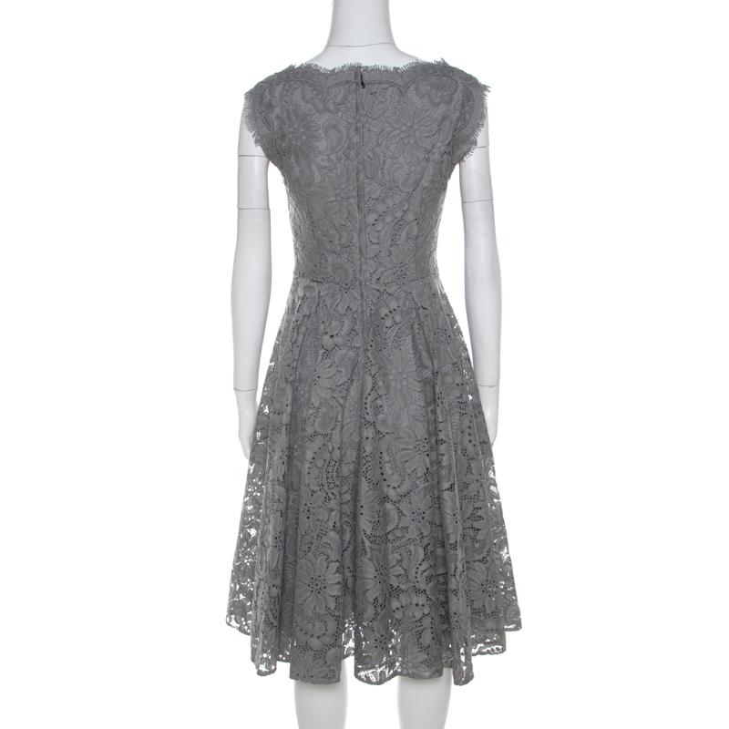 From the house of Dolce and Gabbana, this dress is a masterpiece creation. For a standout look this season, flaunt this blended fabric attire designed with a lace overlay into a flared silhouette. Celebrate the season with grey this stunning dress.

