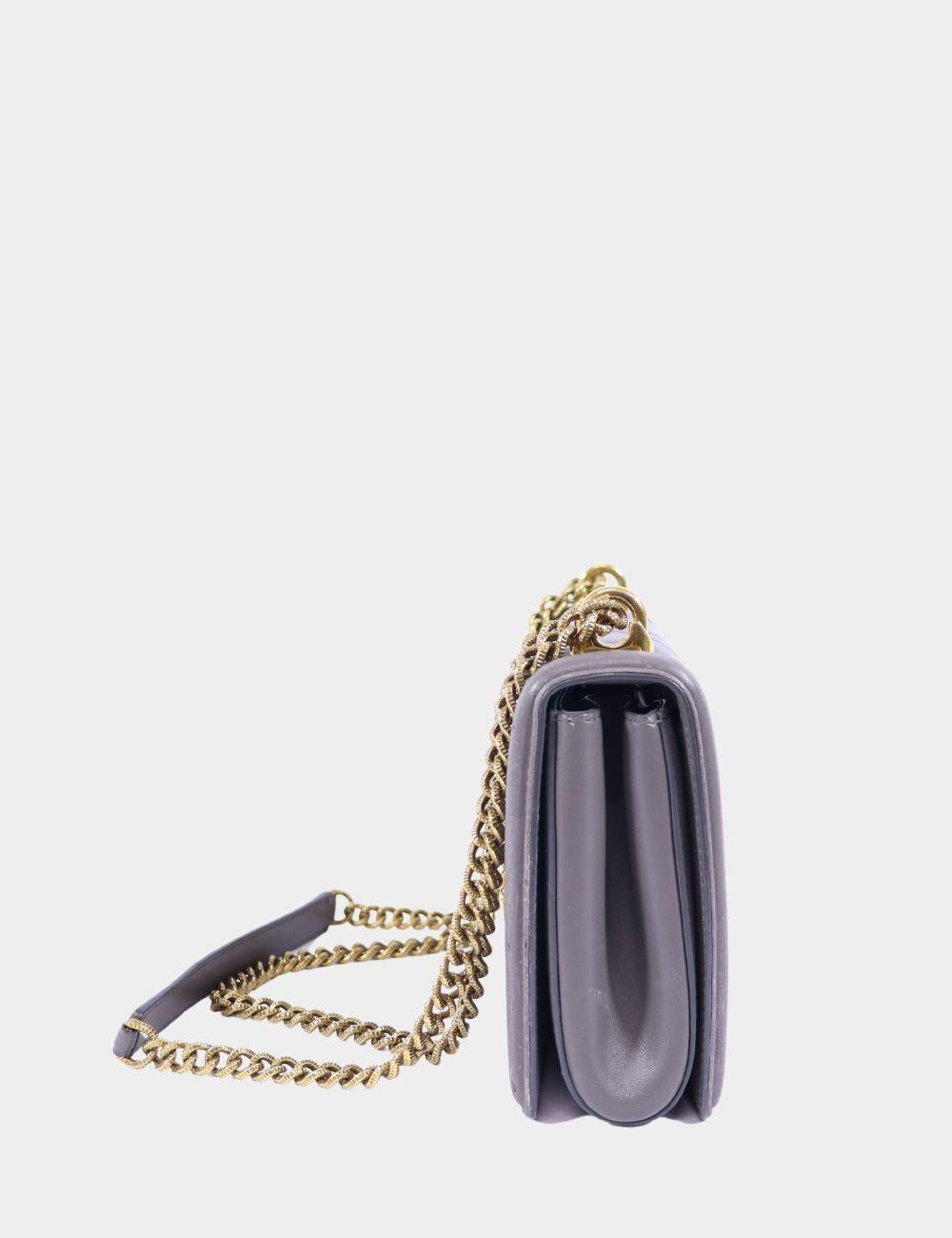 Dolce & Gabbana Medium Devotion grey quilted crossbody bag with 'DG' studded gold heart detail in the front. 

Additional information:
• Adjustable chain shoulder strap with nappa leather insert so it can be worn over the shoulder or across the