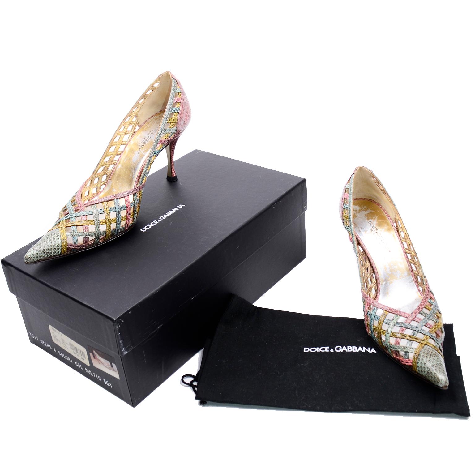 These Dolce & Gabbana pointed toe shoes are beautifully woven with multi color snakeskin in shades of pink, purple, green and blue. These stunning pumps come with their original box with tags and their original dust bag. The shoes have leather soles