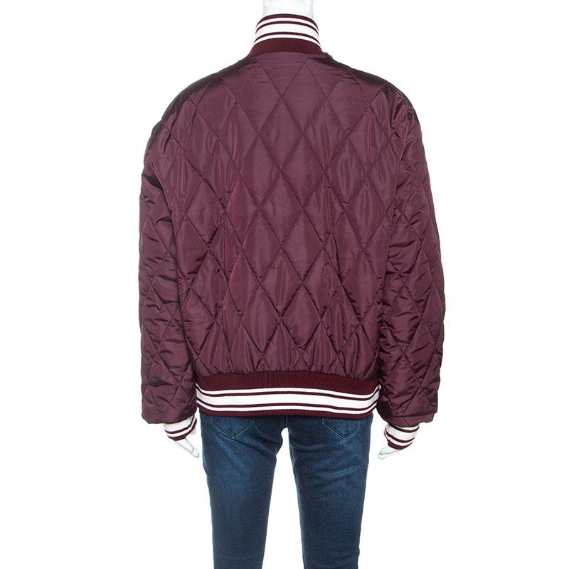 If you have an eye for fun clothing then this jacket by Dolce & Gabbana will surely impress. Adopt a contemporary style with satisfaction through this burgundy creation made from nylon. It features a front zipper, pockets and feminine