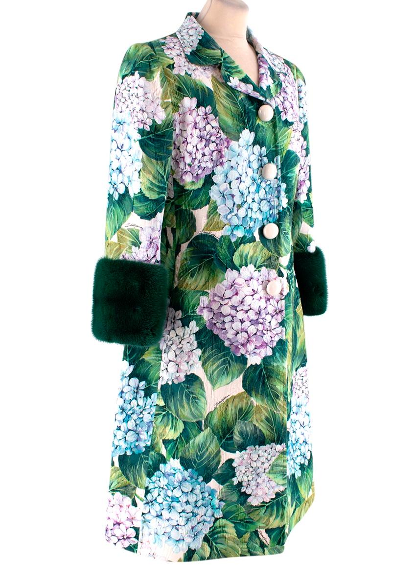  Dolce & Gabbana Hortensia Mink Cuff Dress Coat
 

 - Rounded notch lapel dress coat featuring a vibrant all-over hydrangea print in blue, lilac and green brocade
 - Crafted from lightweight silk-cotton, trimmed with opulent dark green dyed mink