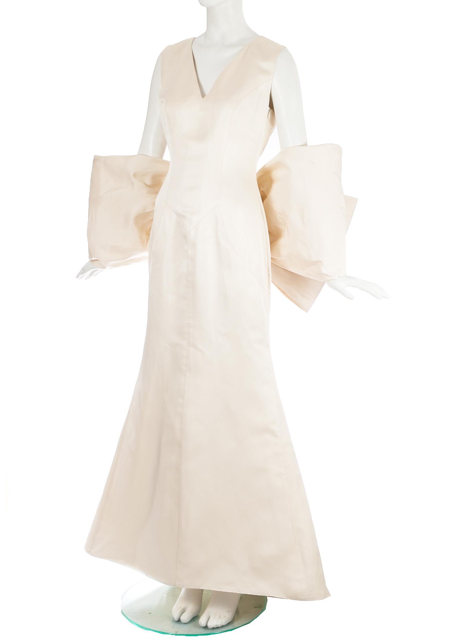 Women's Dolce & Gabbana ivory silk fishtail wedding dress with large bow, c. 1990s For Sale