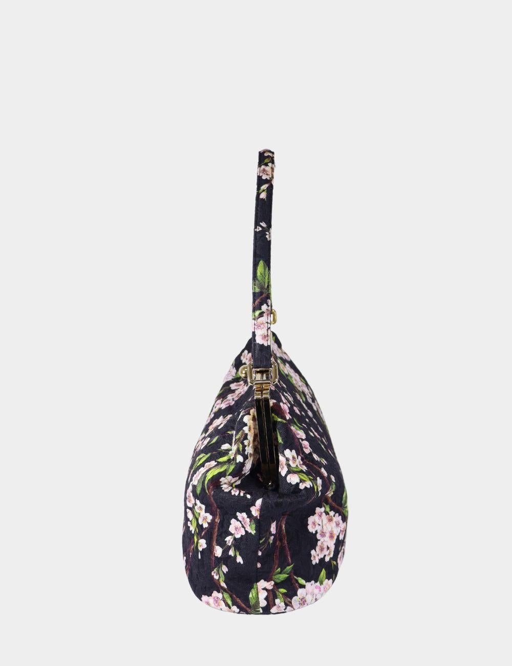 Dolce Gabbana Japanese Floral Cherry Blossom Shoulder Bag, Features a kisslock, cherry blossom print, shoulder strap, vintage style, and 3 interior pockets.

Material: Fabric
Hardware: Gold
Height: 24cm
Width: 31cm
Depth: 15cm
Handle Drop: