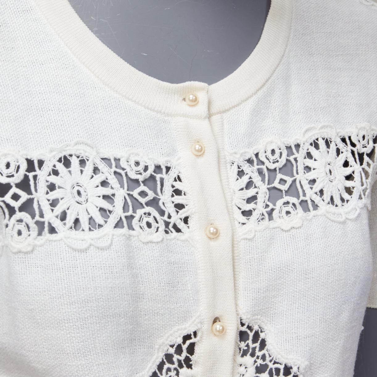 DOLCE GABBANA cream lace eyelet pearl buttons short sleeve cardigan sweater IT44 L
Reference: DYTG/A00016
Brand: Dolce Gabbana
Designer: Domenico Dolce and Stefano Gabbana
Material: Feels like silk
Color: Cream, White
Pattern: Lace
Closure: