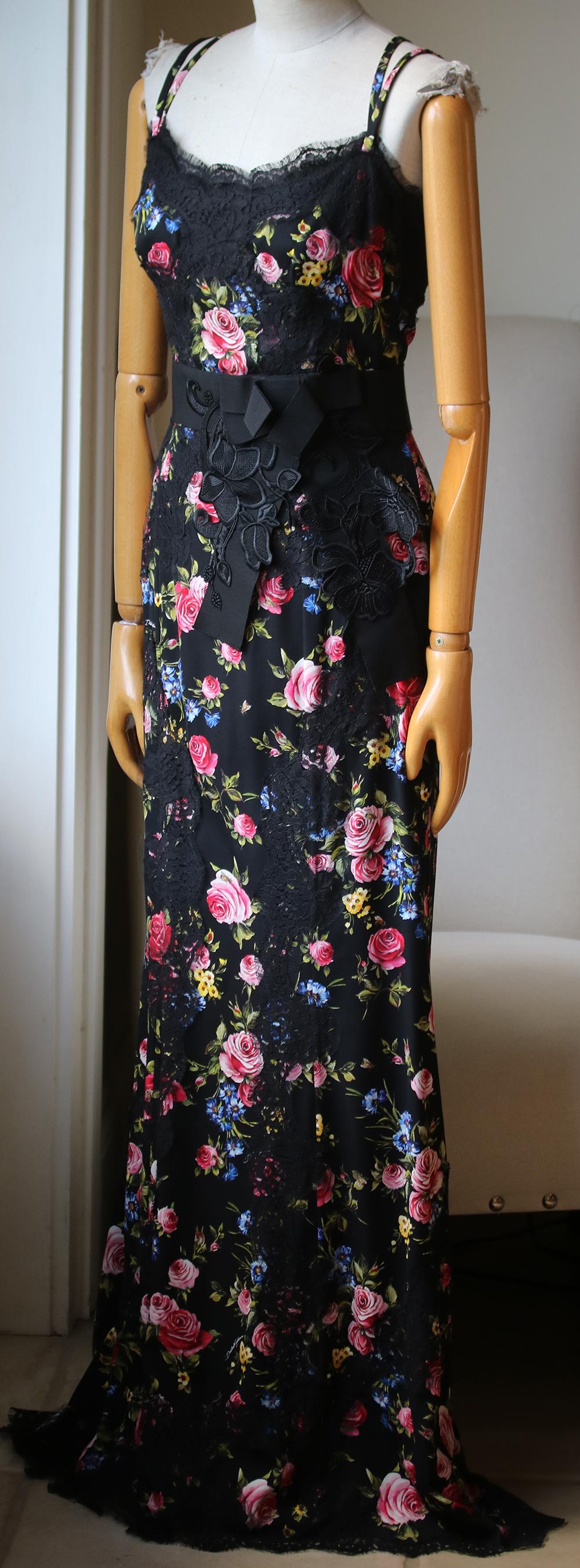 Gown. Maxi length. Satin-crepe. Silk and cotton-blend. Bow-embellished. Lace trim. Floral print. Sleeveless. Waist belt. Hook and zip fastening at back. Fully lined. Flared hem. Lightweight fabric. Made in Italy. 67% Silk, 24% Cotton, 6% Polyamide,