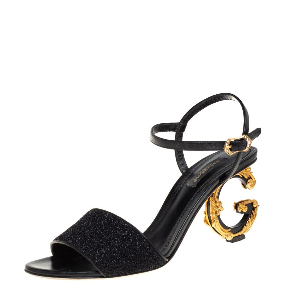 Brimming with artistic excellence, these Keira sandals from Dolce & Gabbana will help you outline a chic look. The black sandals have been crafted from leather and lurex and designed with open toes, single vamp straps, buckled ankle straps, and