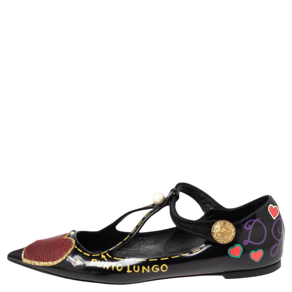 Step out in these stylish ballet flats from the house of Dolce & Gabbana. They have been crafted from quality leather and come in a lovely shade of black. They have been detailed with heart appliqués, pear detailing and pointed toes. They are