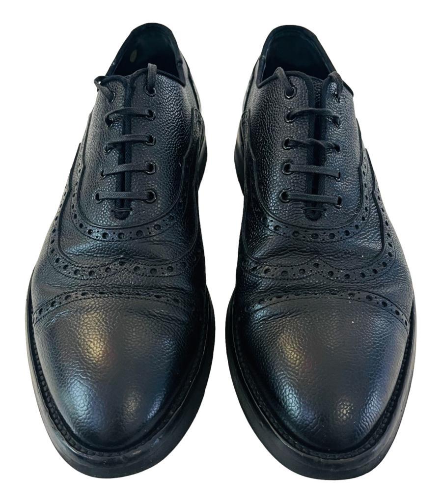 Dolce & Gabbana Leather Oxford Shoes
Black, classy brogues detailed with decorative perforation details.
Featuring lace-up front, almond toe and leather lining.
Size – 9
Condition – Good (General signs of wear)
Composition – Leather
Comes with –