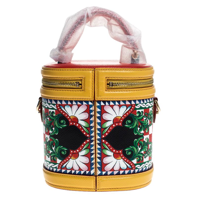 It really does take a few seconds to believe that there could be anything as chic as this DG Girls Vanity bag from Dolce & Gabbana! The beauty bag is perfect for your fashion arsenal, bringing along the iconic Sicilian print all over, a sturdy top