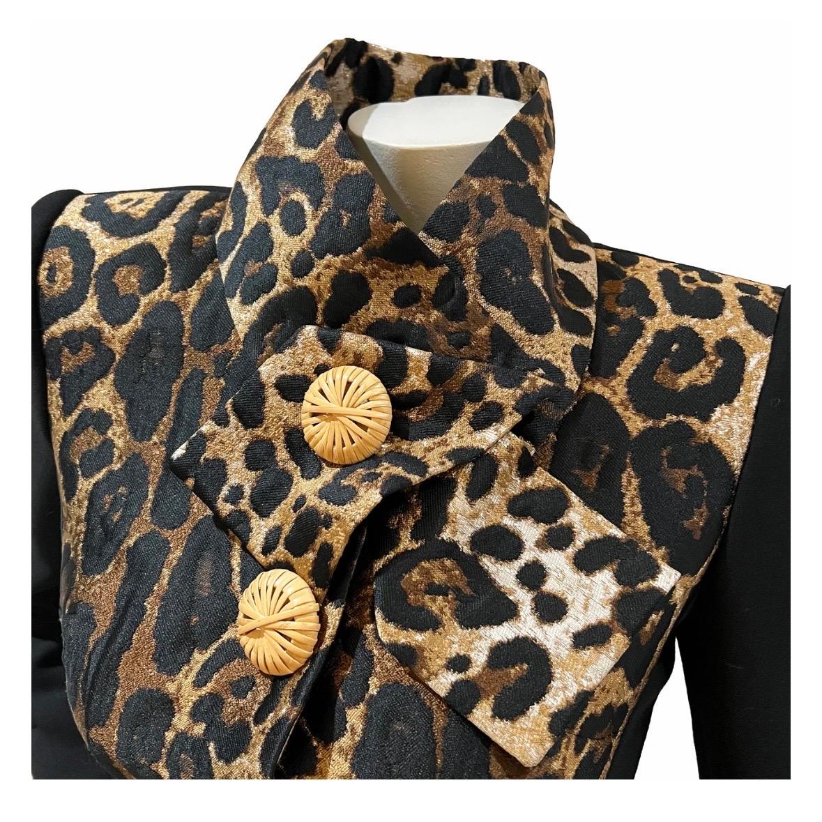 Leopard jacket by Dolce & Gabbana 
Spring 2020 Ready-to-Wear
Made in Italy
Leopard print bodice
Black sleeves
Decorative oversized rattan buttons down front
Front snap closure 
Triple rattan cuff button detail 
Asymmetrical collar   
Padded