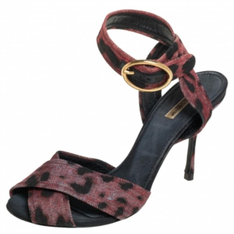 These sandals from Dolce & Gabbana will lend a stylish and playful edge to your feet. Crafted from leopard print fabric, they have a lovely silhouette. They feature crisscross front straps, buckled ankle straps, 10 cm heels and leather soles. They