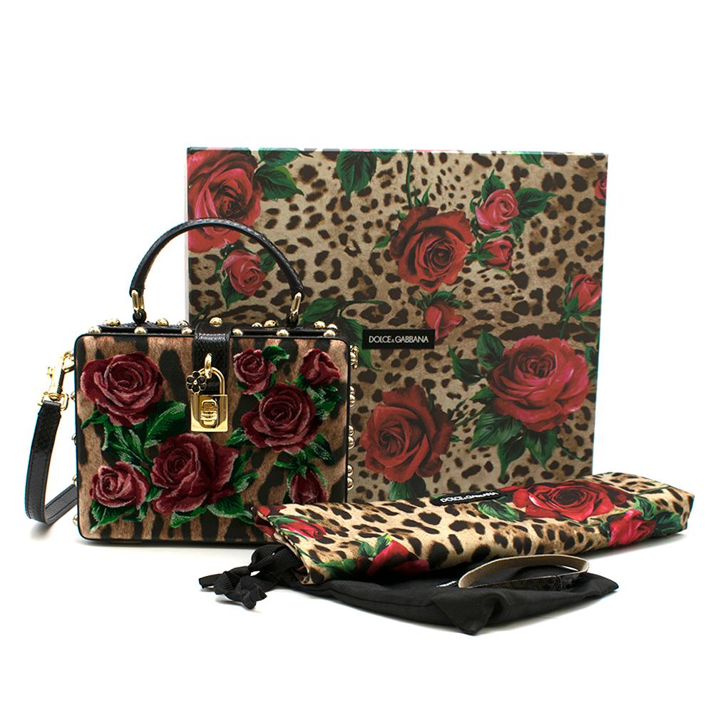 Dolce & Gabbana Leopard-Print Floral Velvet Box Bag

- Velvet leopard and rose detail
- Lined in black snakeskin leather detail
- Gold studs and hardware
- Gold lock at buckle
- Props open at an angle
- Pockets in good condition
- Convertible long