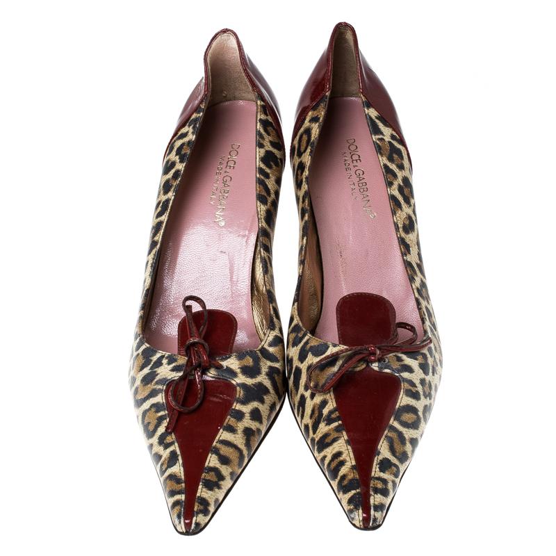 These Dolce & Gabbana pumps with a covetable silhouette and a trending leopard-print make for the perfect switch for your everyday work heels. Designed with pointed toes, the pumps flaunt burgundy inserts along with bow detail on the vamps. Complete