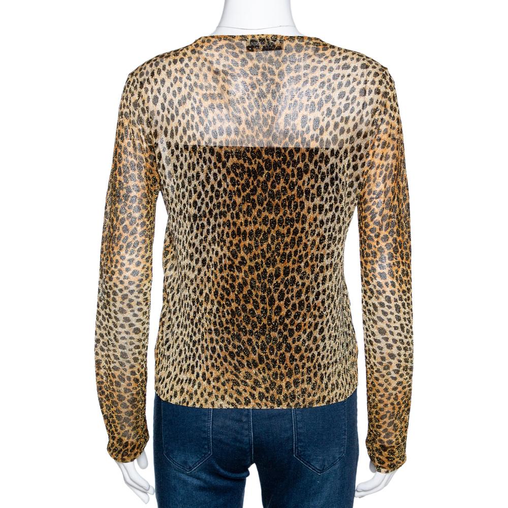 This stylish top comes from the house of Dolce & Gabbana. Crafted from sheer knit fabric, it has a leopard lured print that adds a hint of glamour. It is styled simply with a v-neck, long sleeves and a relaxed fit. It is great for fun outings with