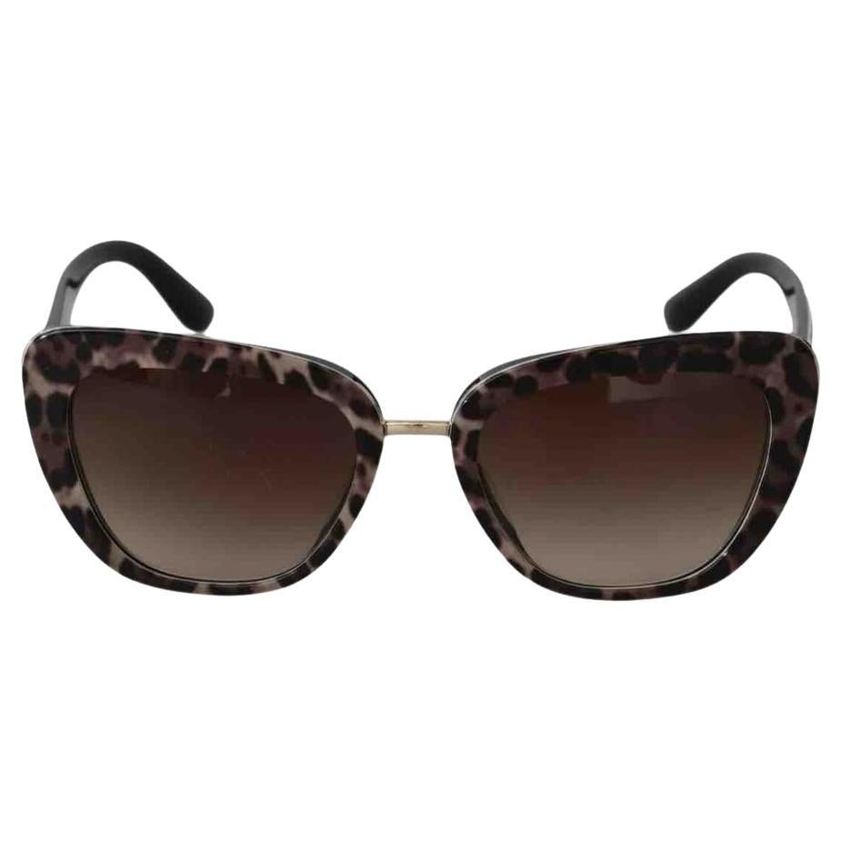 Dolce 
Gabbana - Lunettes de soleil en verre dégradé en plastique imprimé léopard en brun en vente