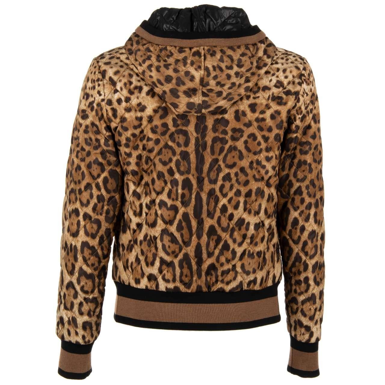 - Padded leopard printed bomber jacket with hoody and embroidered DG Logo by DOLCE & GABBANA - Former RRP: EUR 1.750 - New with tag - Slim Fit - MADE IN ITALY - Model: G9JU0Z-G7MQH-HD13M - Material: 95% Nylon, 5% Lambskin - Lining: 58% Nylon, 42%