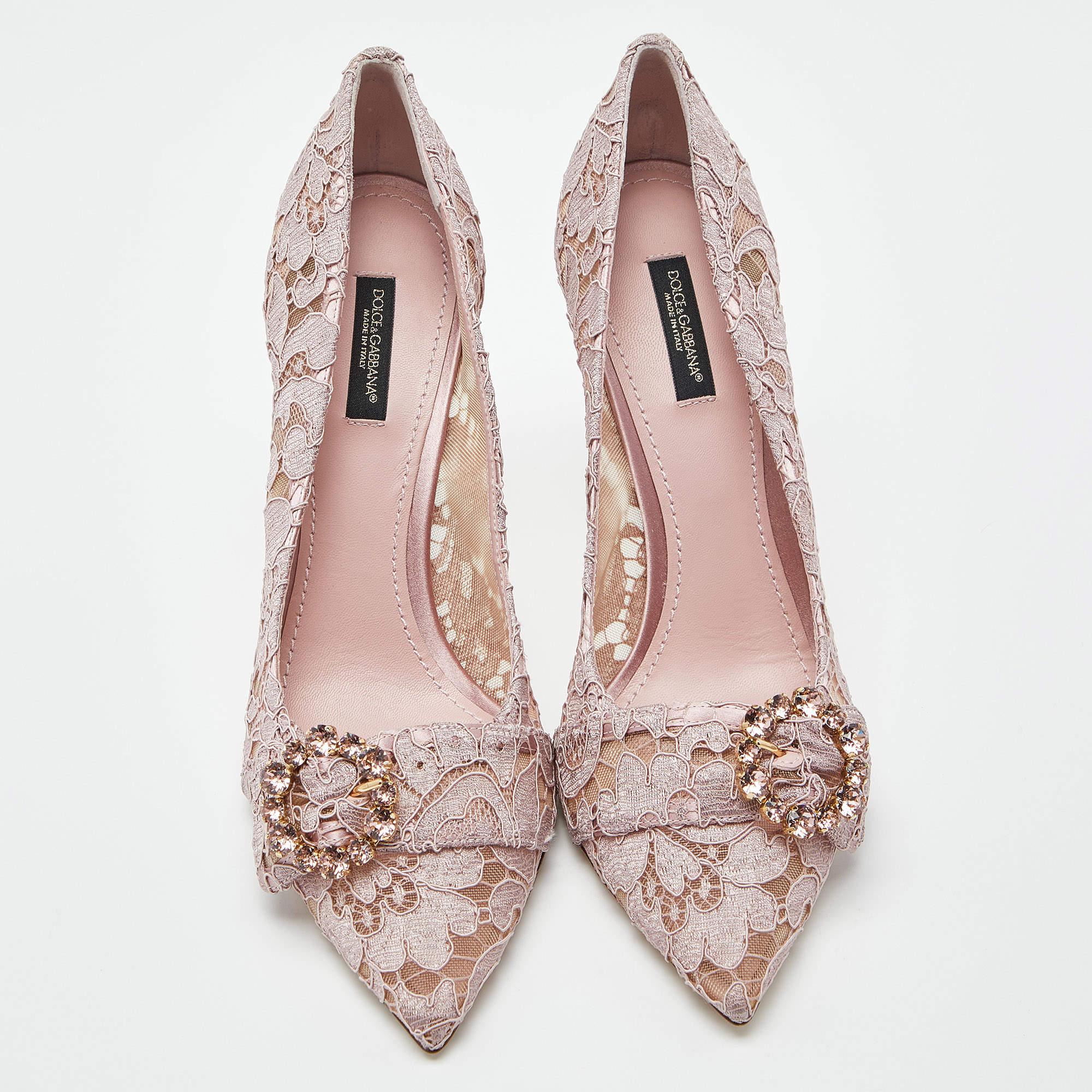 With intricate lace detailing, this pair of Dolce & Gabbana pumps is classy in a lilac shade. Elevated on 10cm heels, it features crystal embellishment on the top and embodies an architectural silhouette.

Includes: Original Box, Original Dustbag

