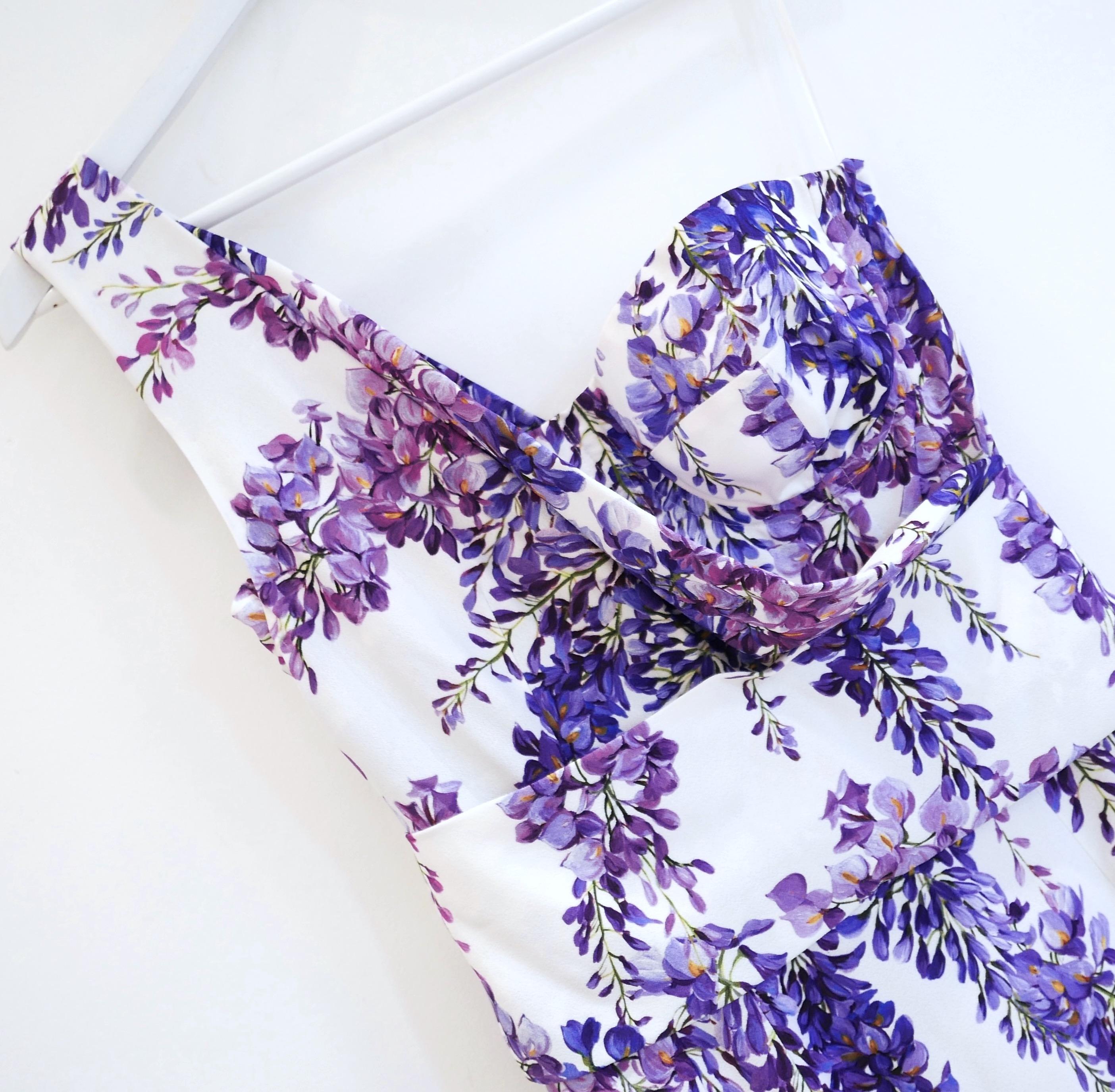 Gorgeous, ultra feminine Dolce & Gabbana lilac print bustier dress. bought for £1950 and new with tags. Made from soft viscose/elastane crepe with a vibrant purple and lilac print,  it has Dolce’s signature bustier cut with internal boning and