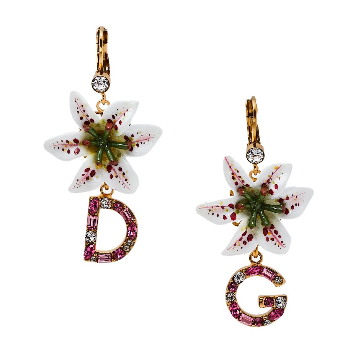 Dolce & Gabbana's collections are a testament to the label's opulent and glamorous aesthetics. These earrings are made from gold-tone metal and feature the lily motifs reflecting the label's love for floral motifs. For the finishing signature touch,