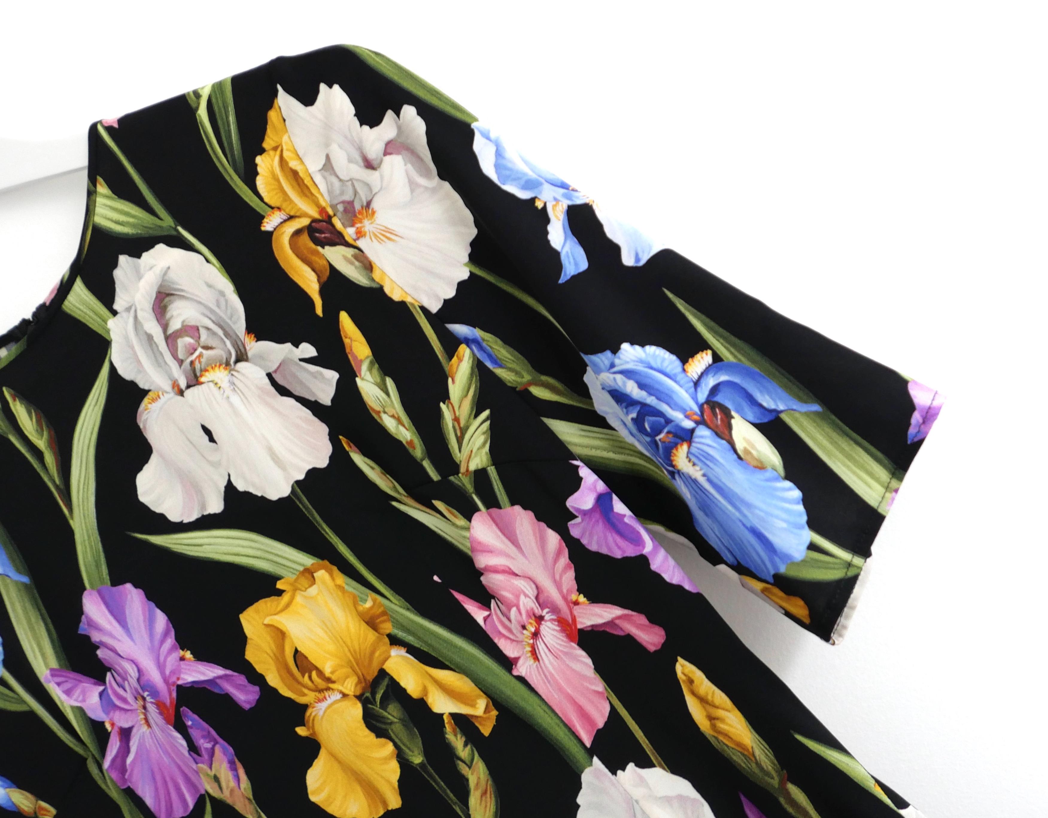 Stunning Dolce & Gabbana lily print top. Bought for £950 and new with tag. Made from super soft black silk and elastane with a gorgeous multicoloured lily print. It has a semi tailored cut with elbow length sleeves, crew neck and concealed zip to