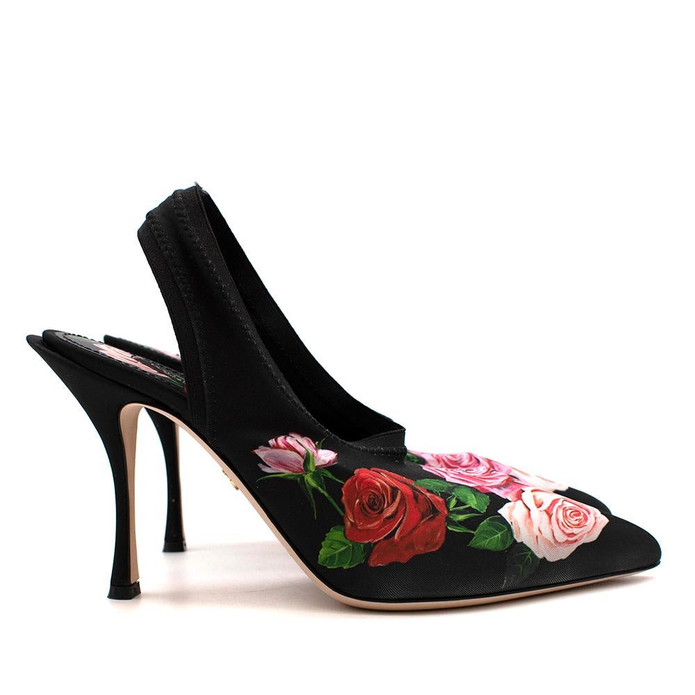 Dolce & Gabbana is not a label to shy away from head-turning looks, as this pair of slingback pumps proves. Crafted in Italy from black stretch-satin with a lush floral print, their striking silhouette features a pointed toe, high vamp and