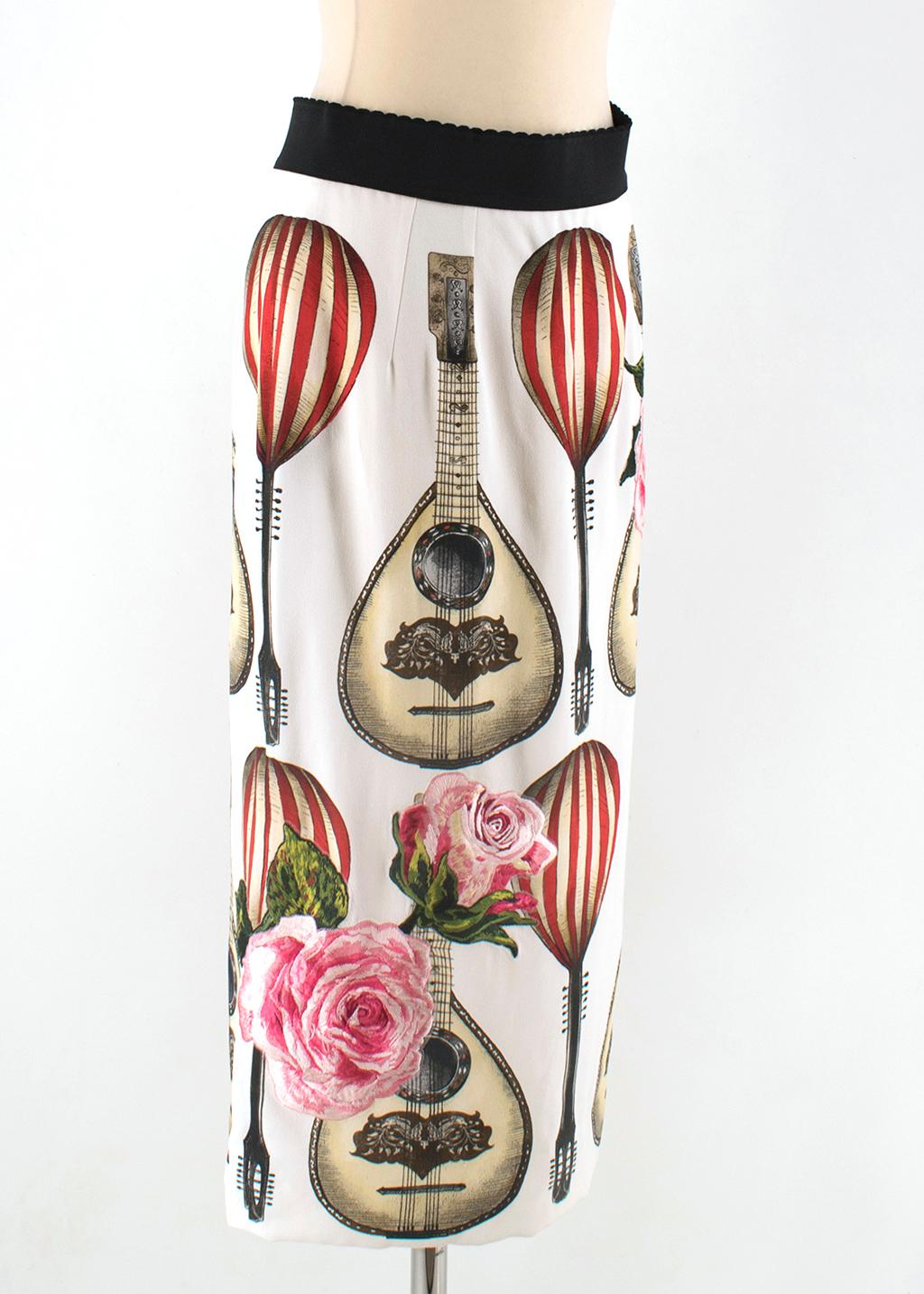 Dolce & Gabbana Mandolin Print Pencil Skirt

- Black elastic waist
- Zipper and hook in back (good condition)
- Vent in back
- Hot air balloon, guitar, and rose pattern
- Roses are embroidered

Please note, these items are pre-owned and may show