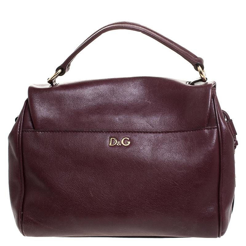 Sophistication and a gorgeous look define this Dolce&Gabbana bag. It is crafted from leather and styled with a top handle, a shoulder strap and a flap to secure the fabric interior. A smart choice for everyday use or special occasions is this lovely