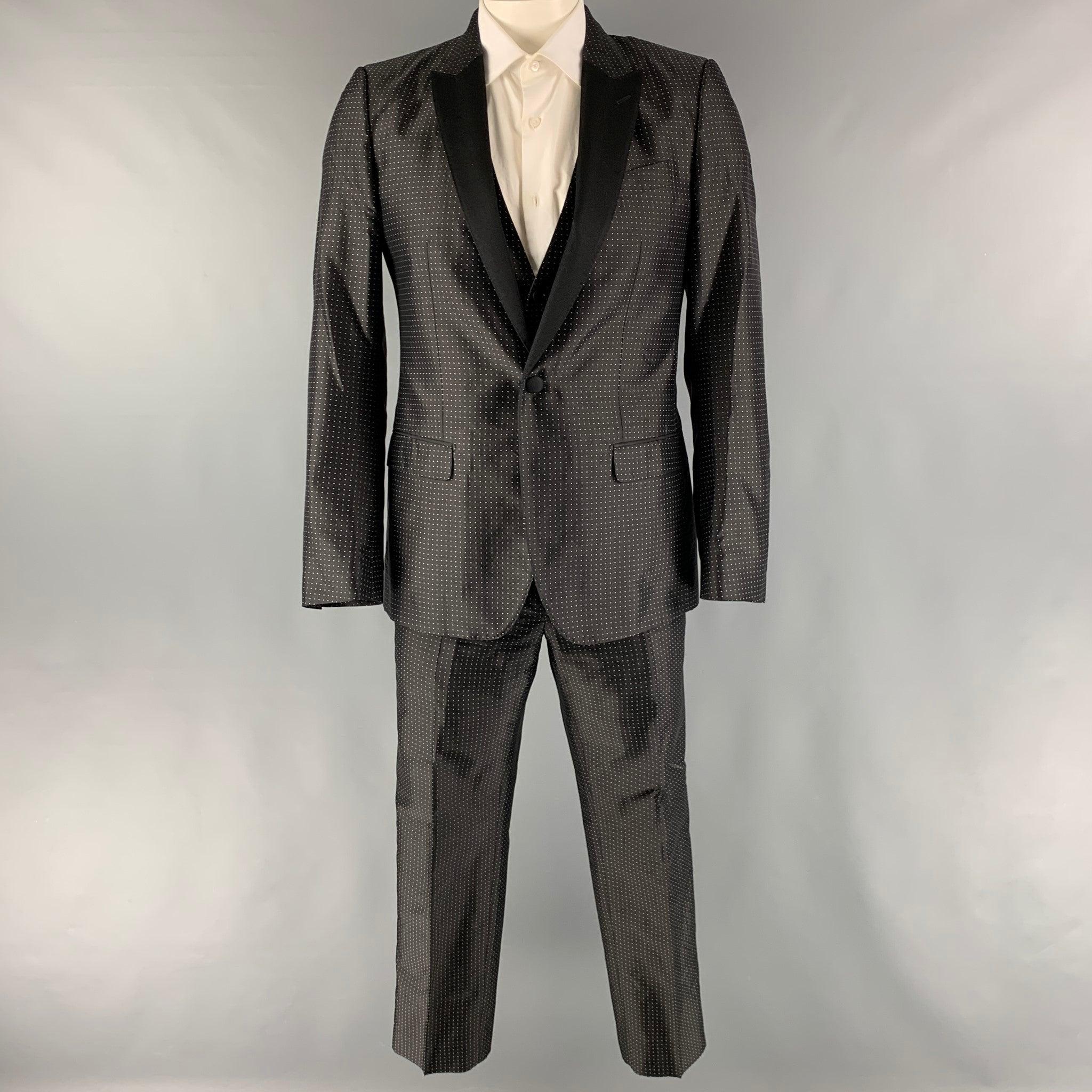 DOLCE & GABBANA 'MARTINI' 3 Piece suit comes in a black and white polka dot silk polyester woven material with a full liner and includes a single breasted, single button sport coat with a peak lapel, matching vest and flat front trousers. Made in