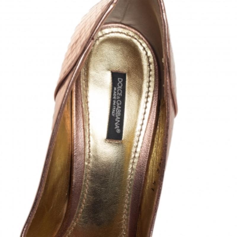 You are sure to love these amazing pumps from Dolce & Gabbana as they're well-built and utterly gorgeous! They've been crafted from metallic bronze python-embossed leather and designed with peep-toes, bow detailing on the uppers, 10.5 cm stiletto