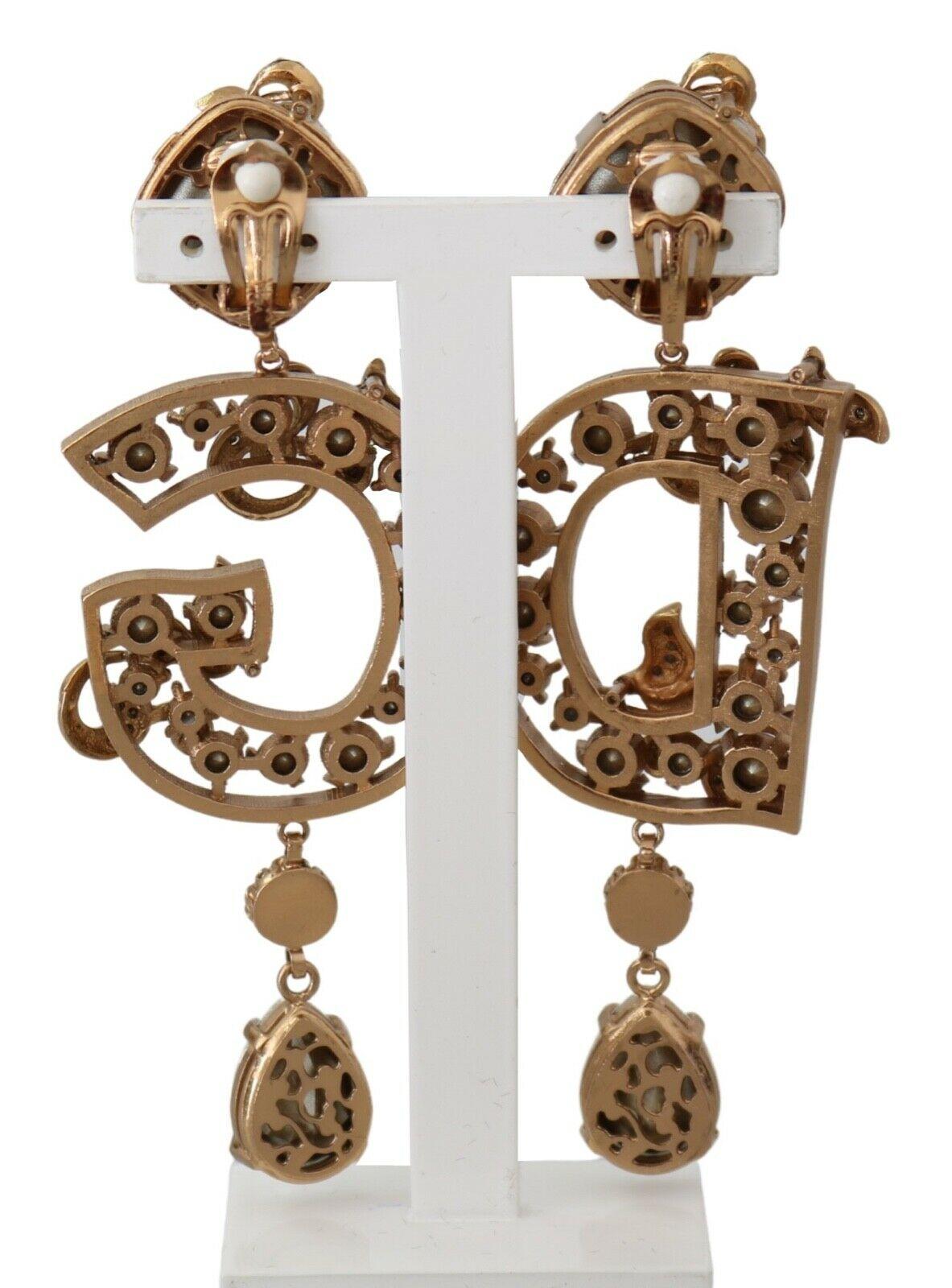 Gorgeous brand new with tags, 100% Authentic Dolce & Gabbana metallic DG crystal clip-on drop earrings.




Model: Clip-on, drop
Motive: Logo
Material: Crystal , Brass

Color: Gold

Crystal: Clear

Logo details
Made in Italy

Length: 10cm



Dolce &