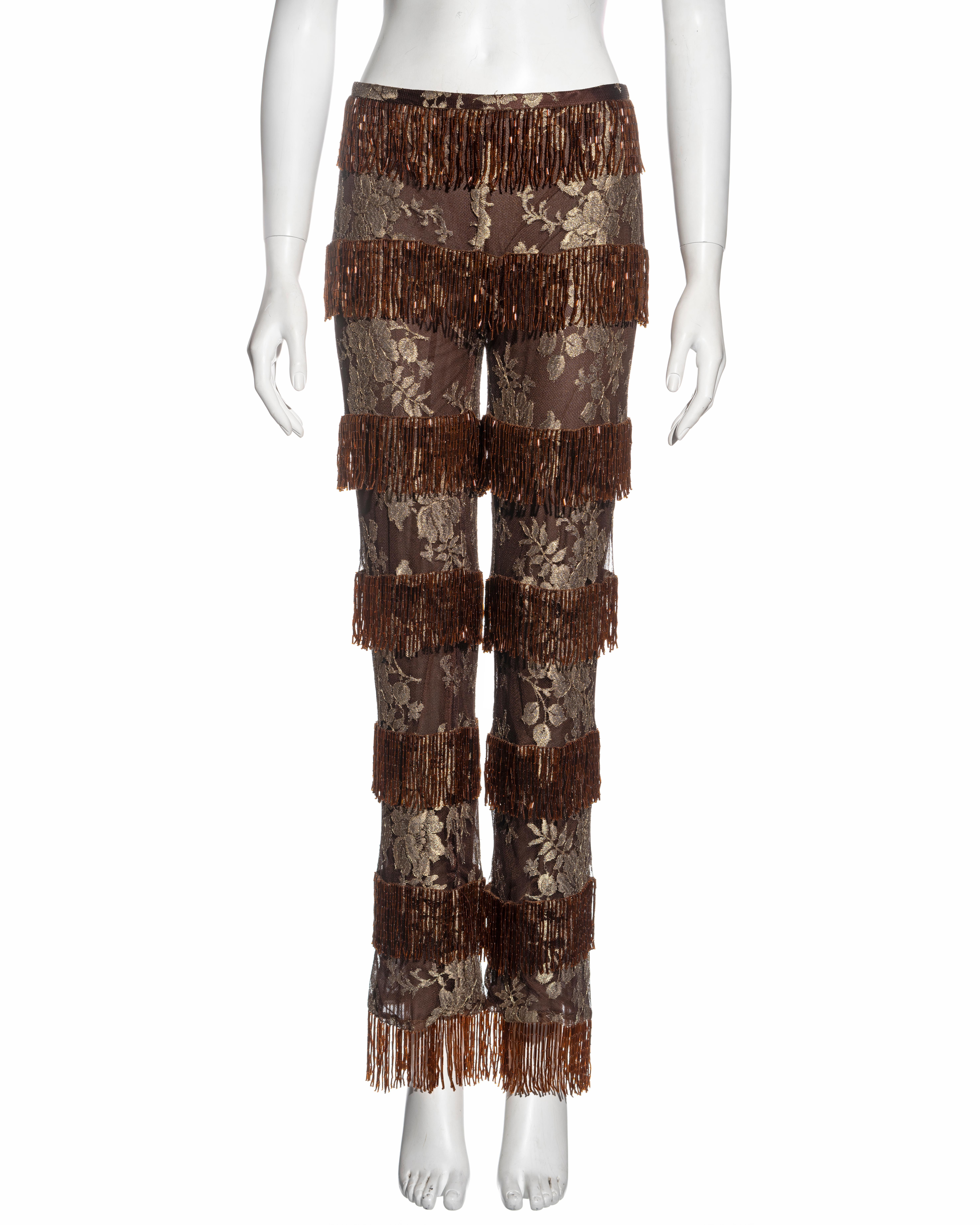 ▪ Dolce & Gabbana evening pants 
▪ Fine antique gold lace 
▪ Copper bugle beaded fringe 
▪ Brown lining 
▪ Straight leg 
▪ IT 42 - FR 38
▪ Spring-Summer 2000
▪ 42% Polyester, 30% Viscose, 28% Nylon
▪ Made in Italy