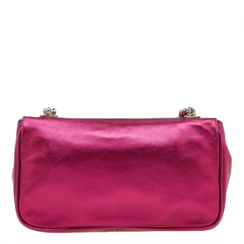 This shoulder bag from Dolce & Gabbana is crafted from metallic pink leather. The bag features a chain shoulder handle, front logo plaque detail, and a fabric-lined compartment. This creation is easy to carry on any day.

Includes: Original Dustbag