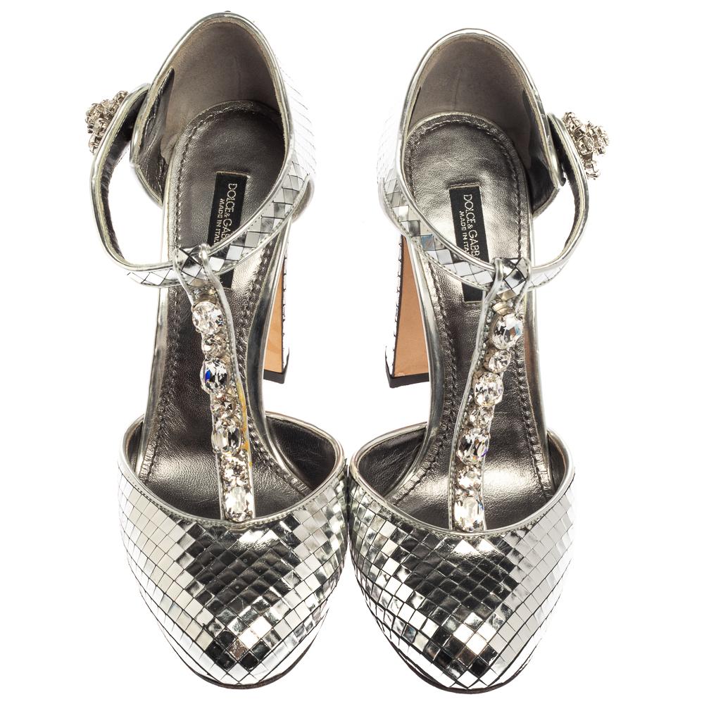 The search for your next perfect party shoe ends here with these stunning Dolce & Gabbana pumps. Crafted from metallic silver leather, the glamourous appeal of the label is highlighted with the crystal-embellishments on the T-straps. The pumps are
