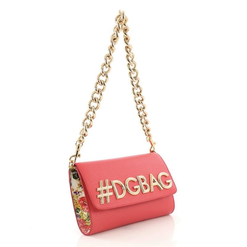 This Dolce & Gabbana Millennials Shoulder Bag Embellished Leather Medium, crafted in pink leather, features a chain-link and leather strap, #DGBAG logo plaque to the front and gold-tone hardware. Its flap opens to a polka dot fabric interior with